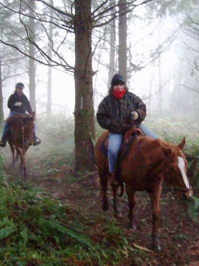 Ron on his mule and Judy riding Spot.