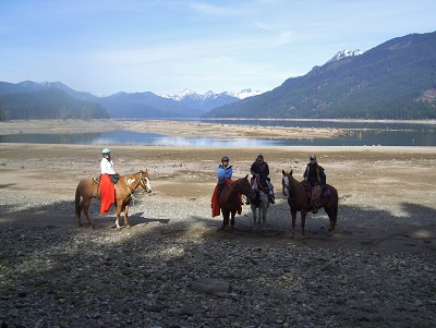Tammy riding Spot, Alyssa riding Hawk, Paxton riding Dolly, and Bobbi riding Apache.