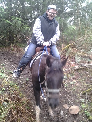DeeDee on Harley is riding a horse for the first time.